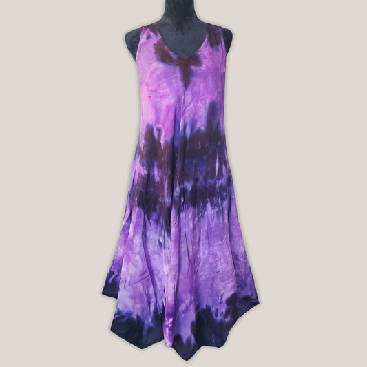 Purple tie-dye dress on a mannequin against a beige background