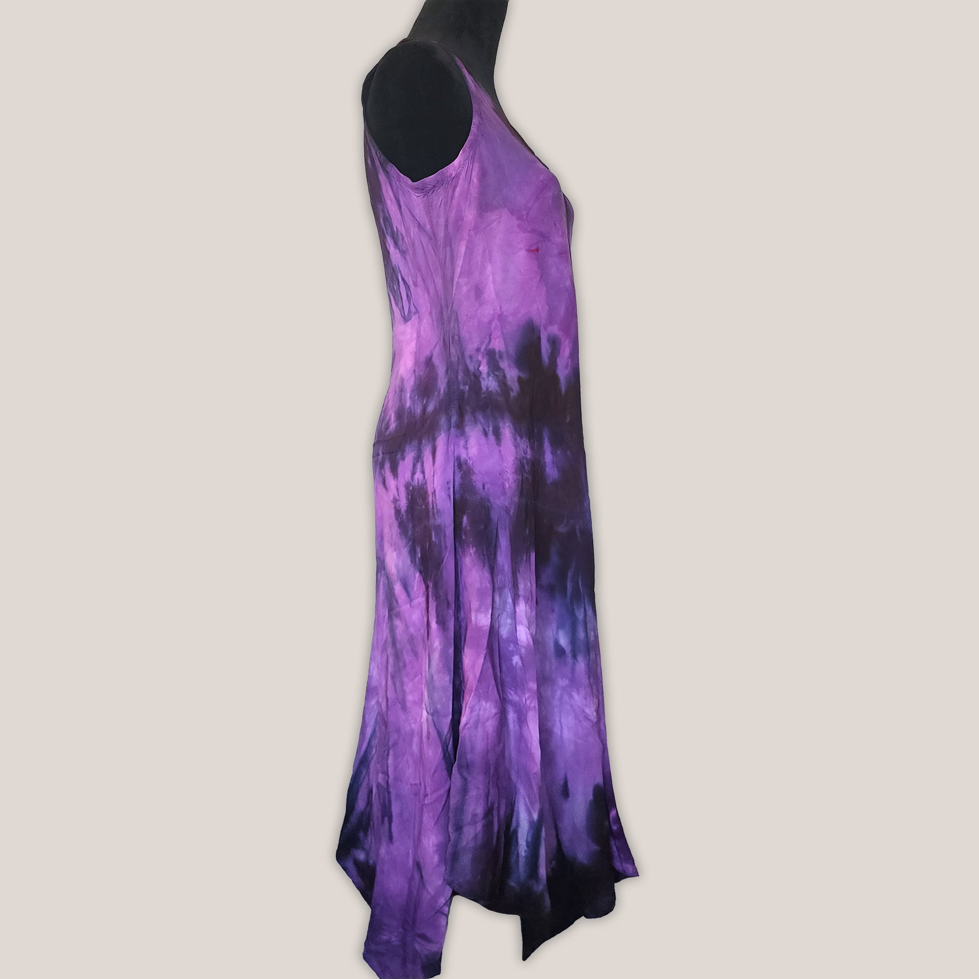 Purple tie-dye dress on a beige background