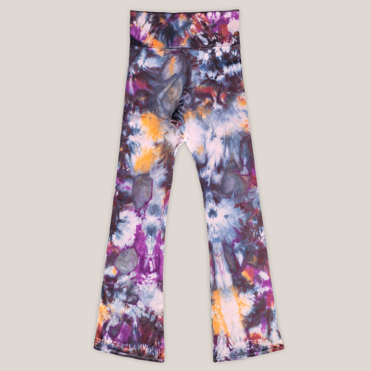 Colorful tie-dye pants on a light gray background