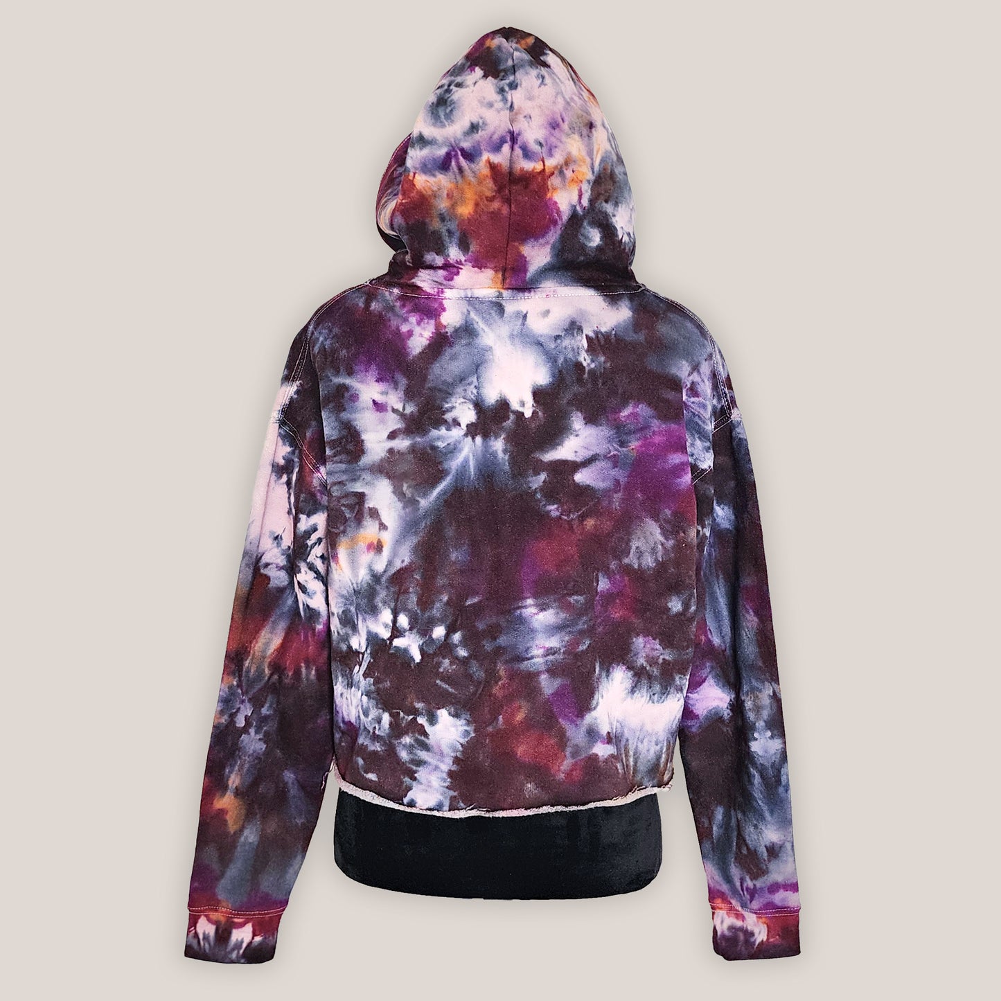 Multicolored tie-dye hoodie on a light gray background