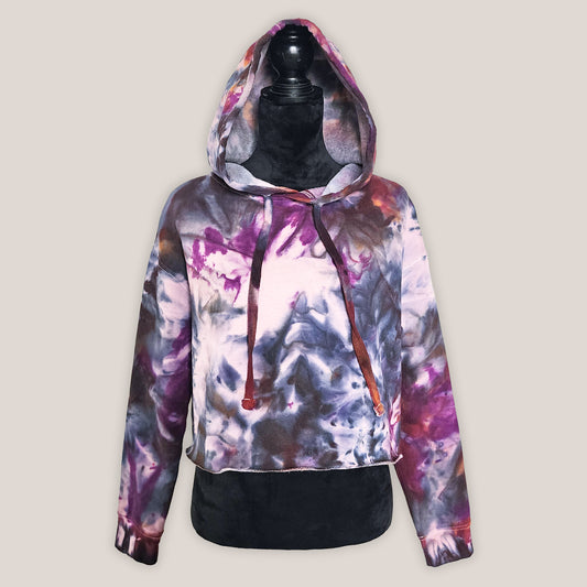 Multicolored hoodie on a mannequin against a plain background