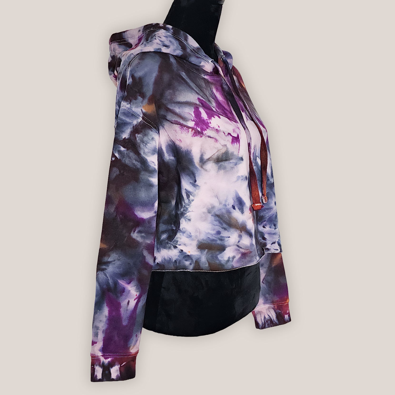 Colorful tie-dye hoodie on a light gray background
