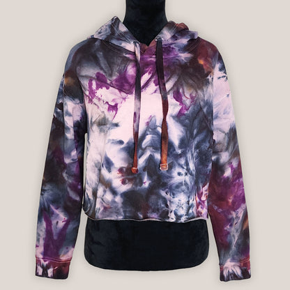 Multicolored tie-dye hoodie on a plain background