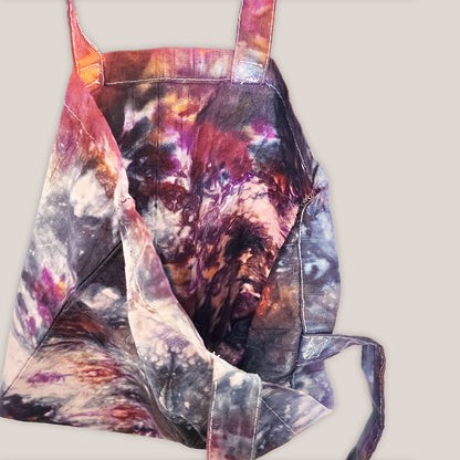 Colorful tie-dye bag on a plain background