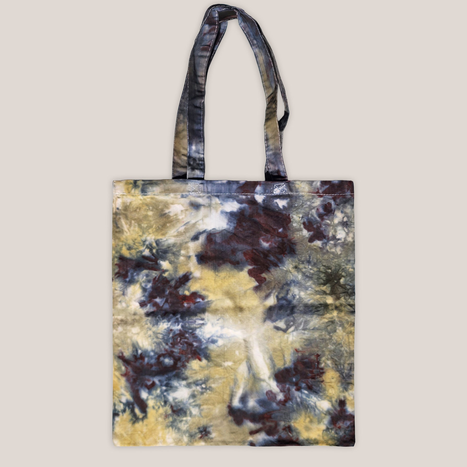 Tote bag with abstract design on a beige background