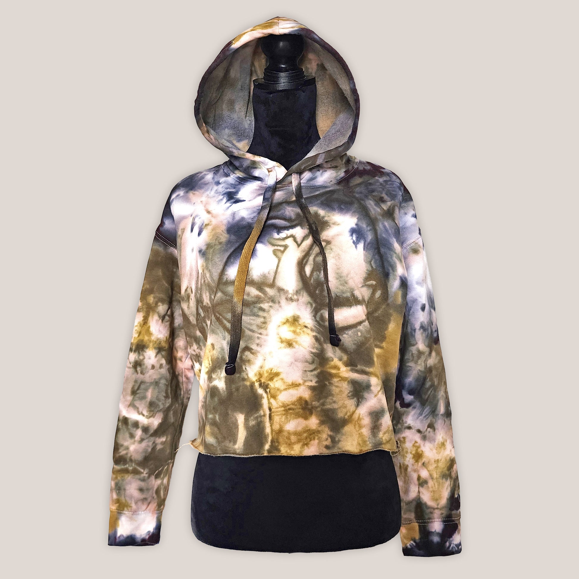 Tie-dye hoodie with a gradient of colors on a plain background