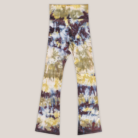 Tie-dye leggings with a multicolor pattern on a beige background