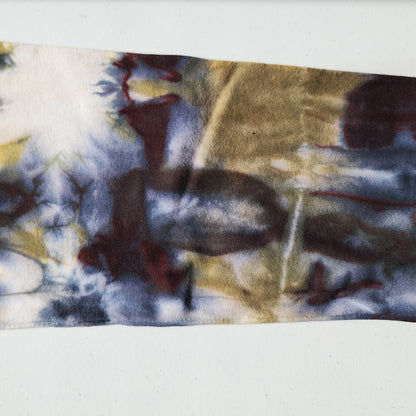 Close-up of a tie-dye pattern on a white background.