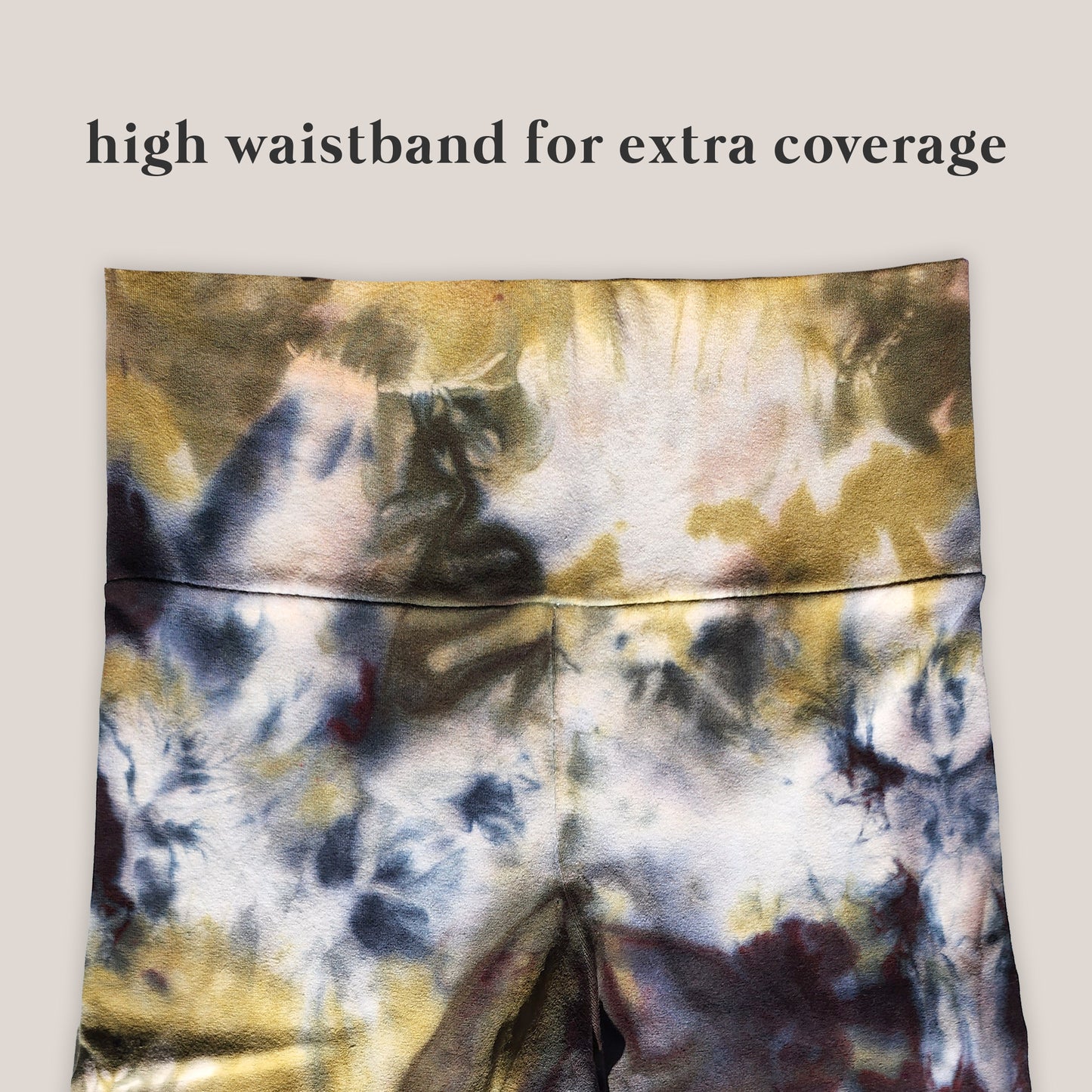 Tie-dye patterned pants with high waistband on a beige background