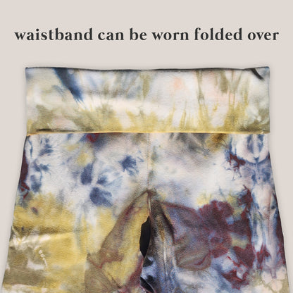 Multicolored tie-dye waistband with text indicating it can be worn folded over.