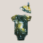 Black + gold tie dye baby bodysuit and baby hat set made of organic cotton.