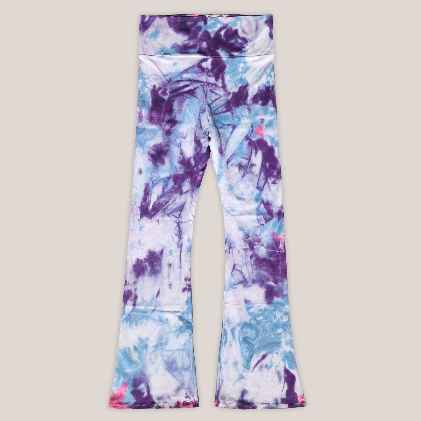 Colorful tie-dye leggings on a light gray background
