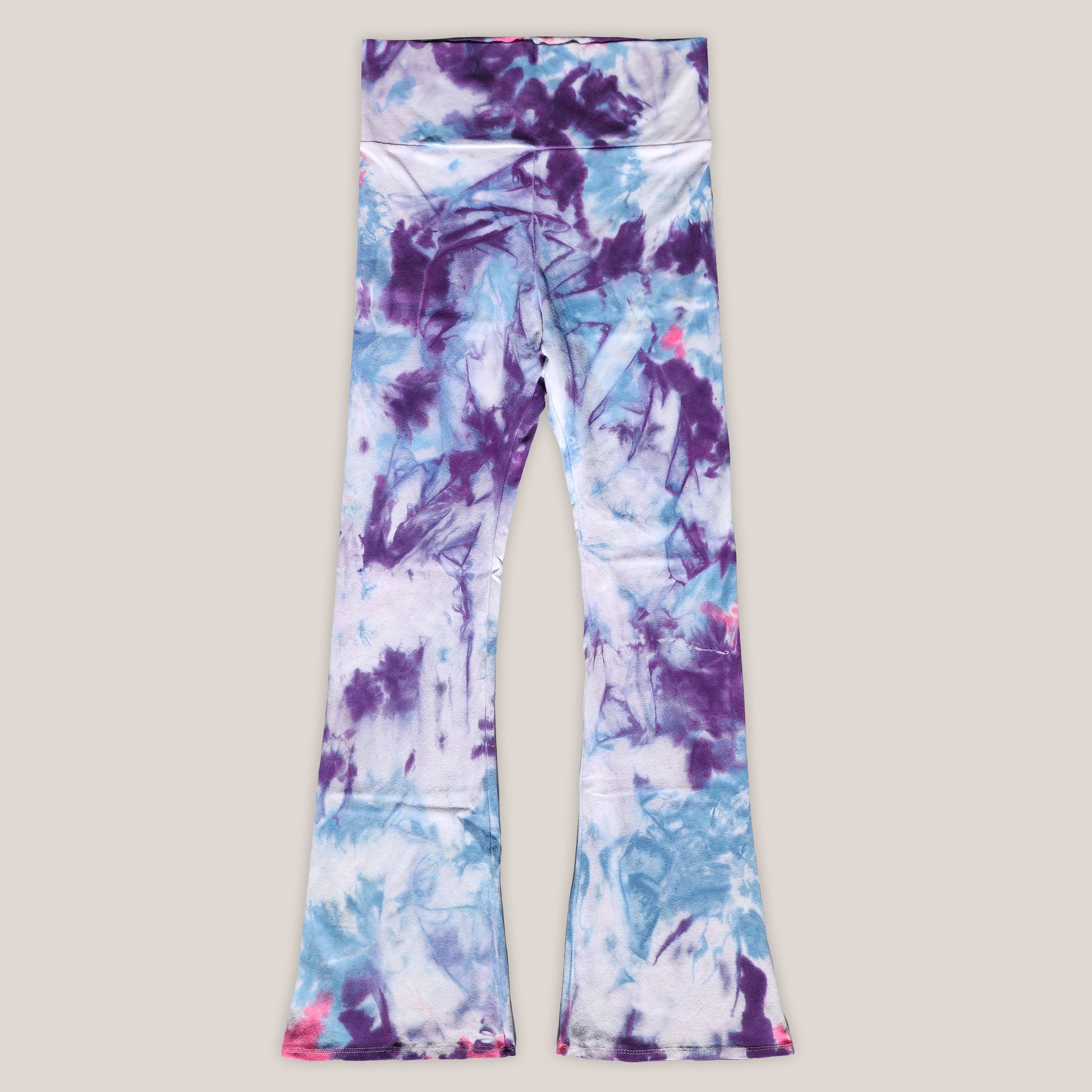 Colorful tie-dye leggings on a light gray background