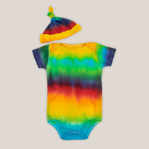 Rainbow organic cotton tie dye baby set with a baby hat and bodysuit.