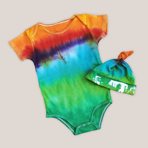 An organic tie dye baby bodysuit and hat in rainbow colors.An organic tie dye baby bodysuit and hat in rainbow colors.