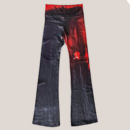 Black and red tie-dye pants on a light beige background