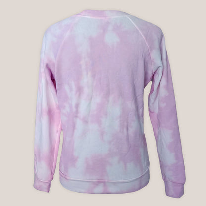 Pink tie-dye sweatshirt on a beige background