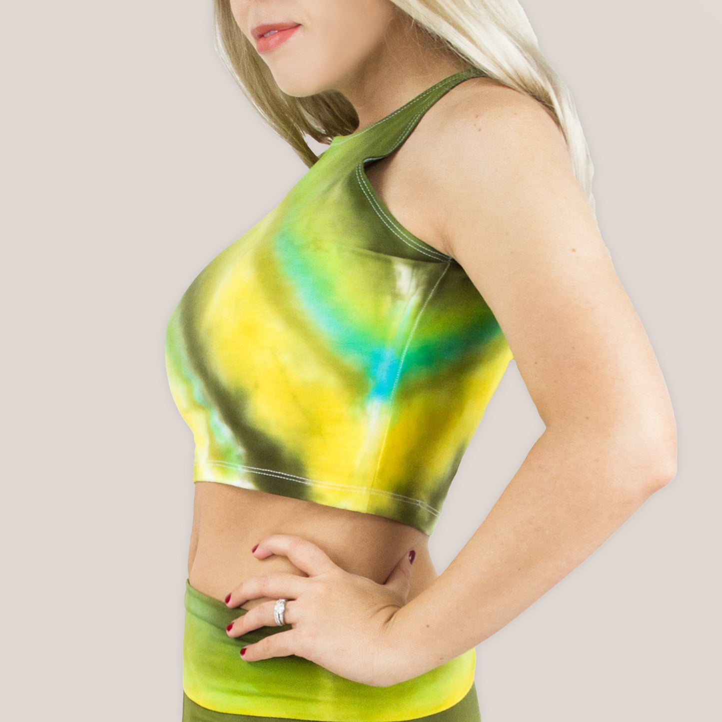 Woman wearing a green tie dye crop top by Akasha Sun.