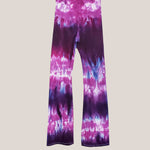 Purple and pink tie dye yoga pants with wide waistband.