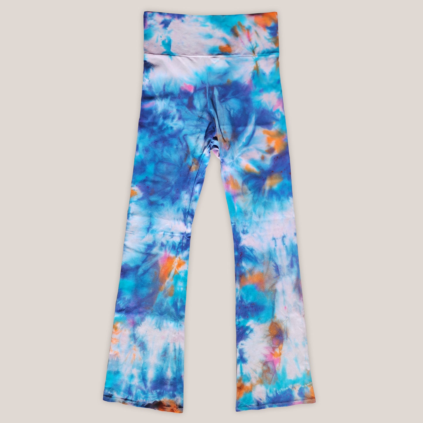 Colorful tie-dye pants on a light gray background