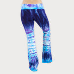 Woman wearing a pair of purple and blue tie dye sustainable yoga pants by Akasha Sun.