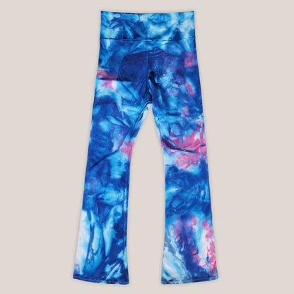 Blue and pink tie-dye leggings on a beige background