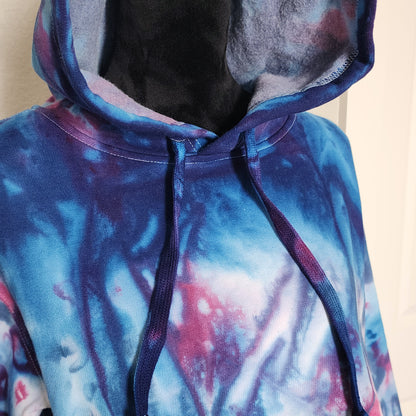 Hoodie with a colorful abstract design on a plain background