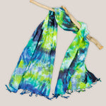 Navy blue, teal, and green tie dye scarf.