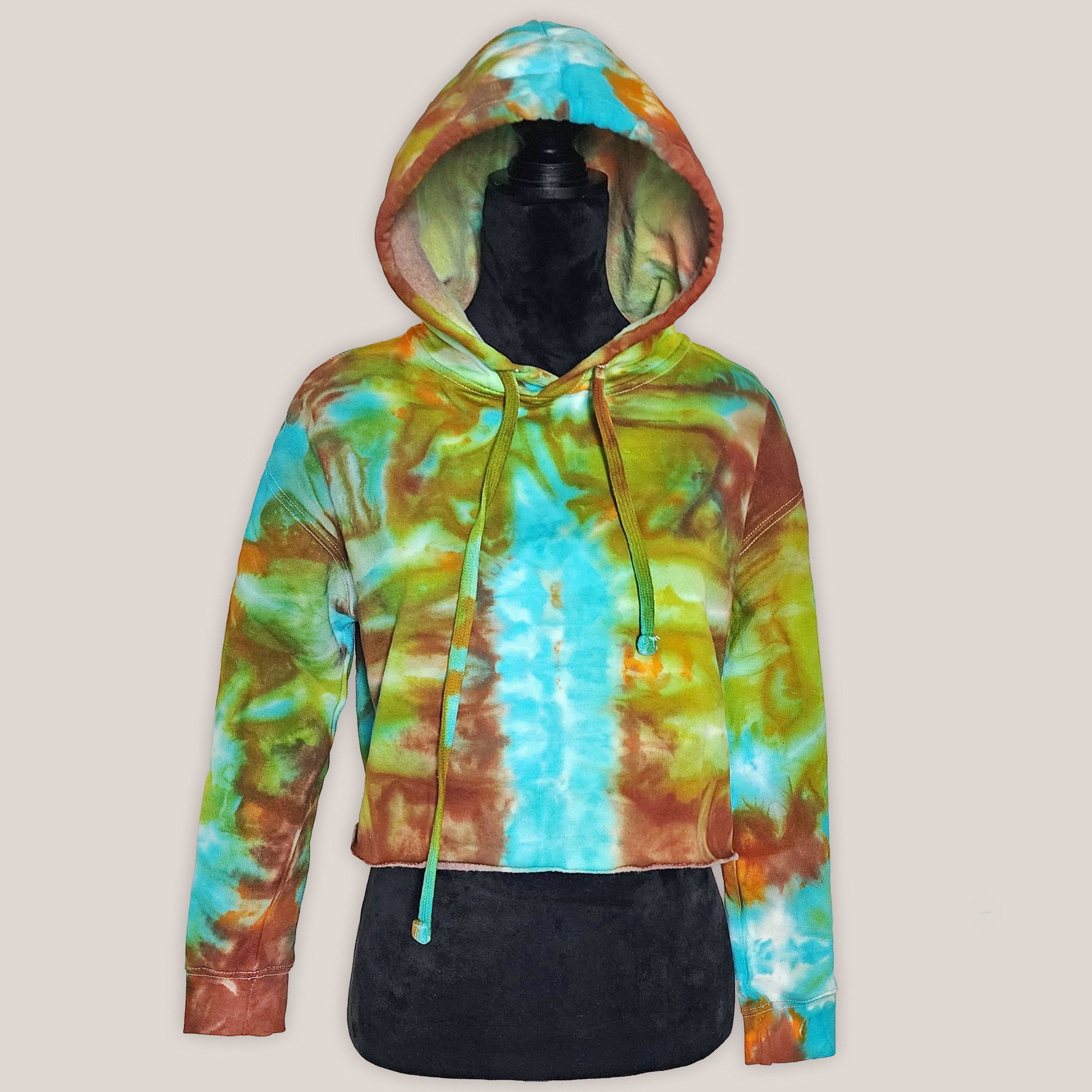Colorful tie-dye hoodie on a mannequin against a plain background