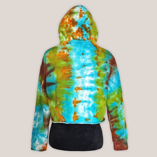 Tie-dye hoodie with a colorful pattern on a beige background
