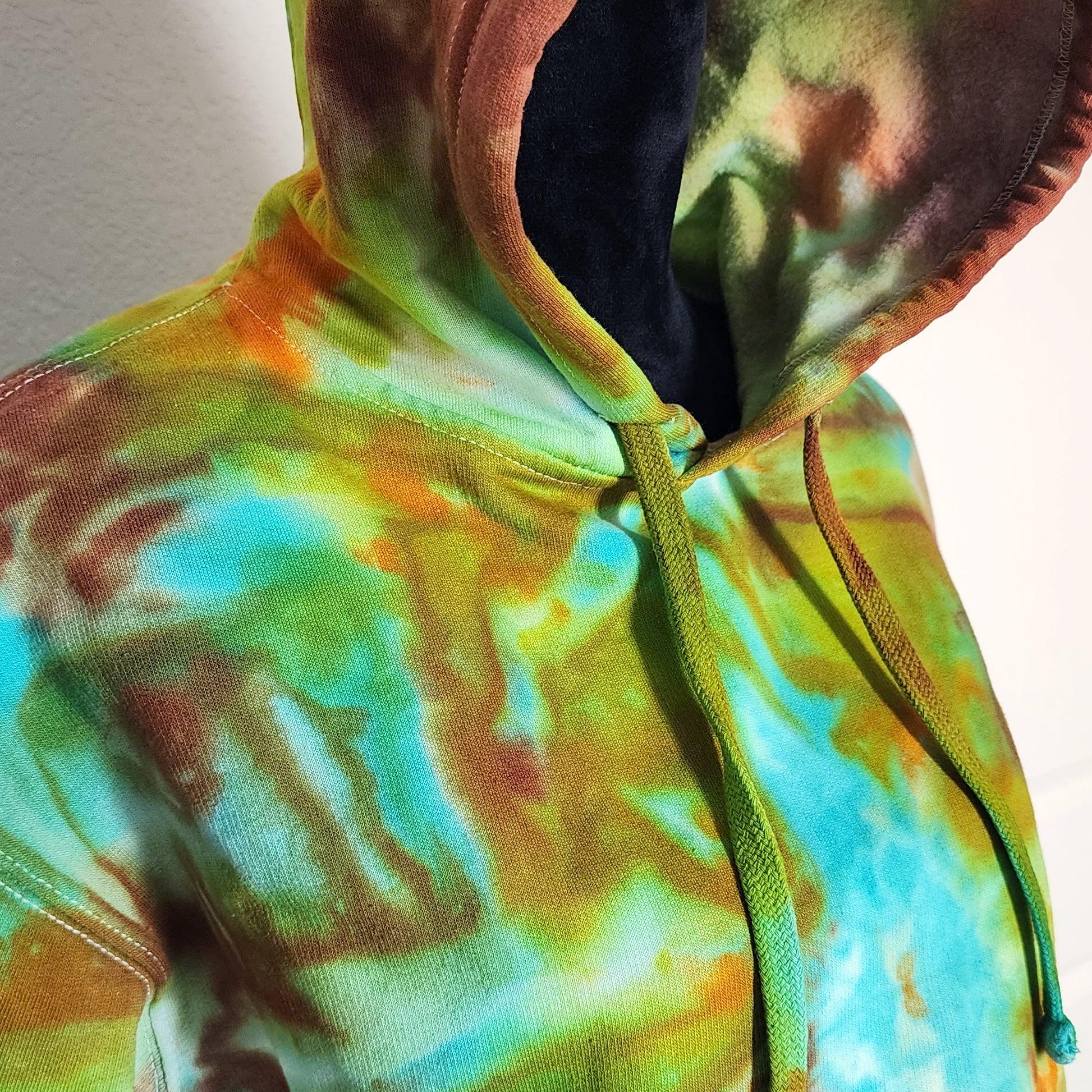 Multicolored tie-dye hoodie with a plain background