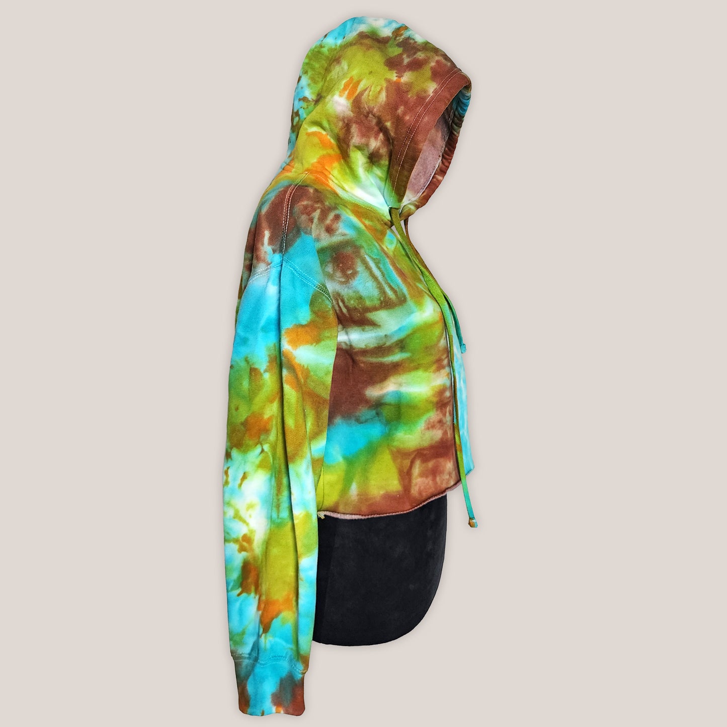 Colorful tie-dye hoodie on a beige background