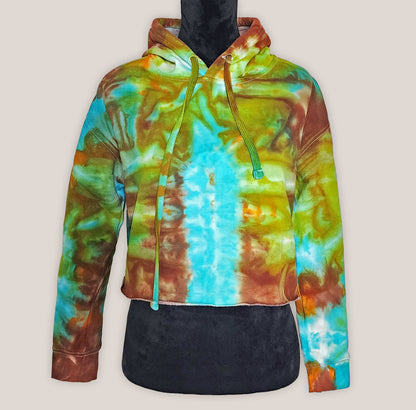 Colorful tie-dye hoodie on a mannequin against a plain background