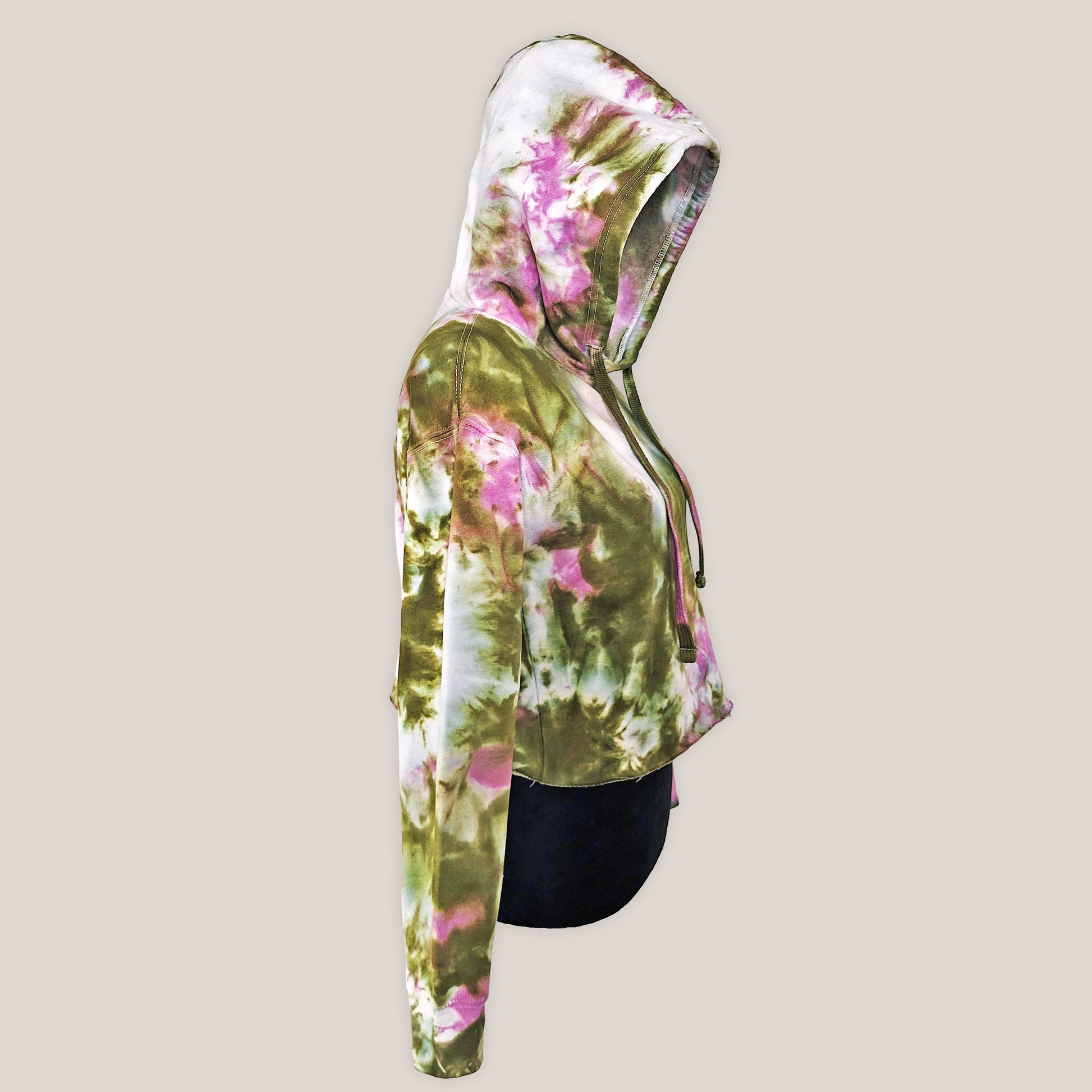 Tie dye patterned hoodie on a beige background.