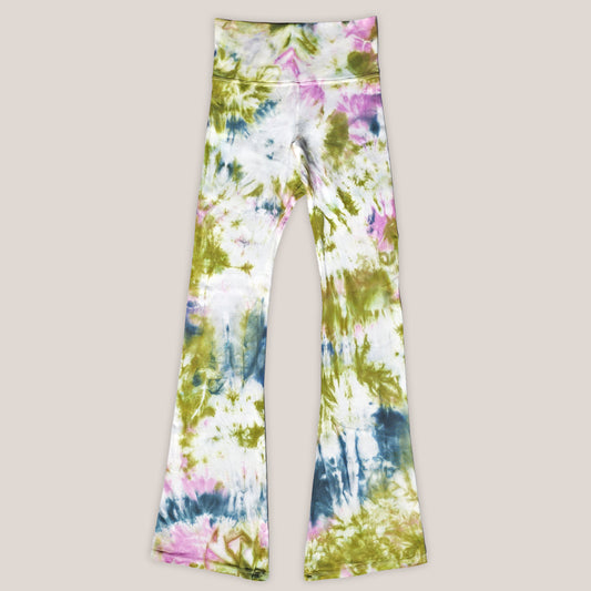 Colorful tie-dye pants on a beige background