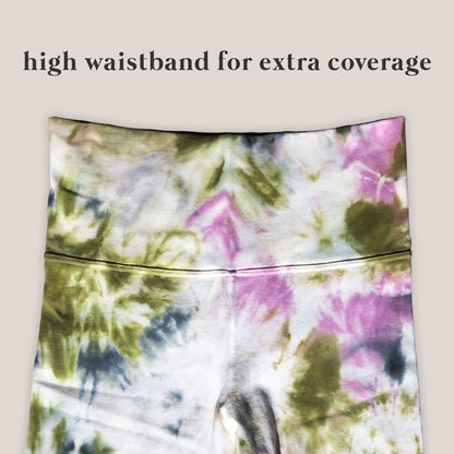 Tie-dye patterned pants with a high waistband on a beige background