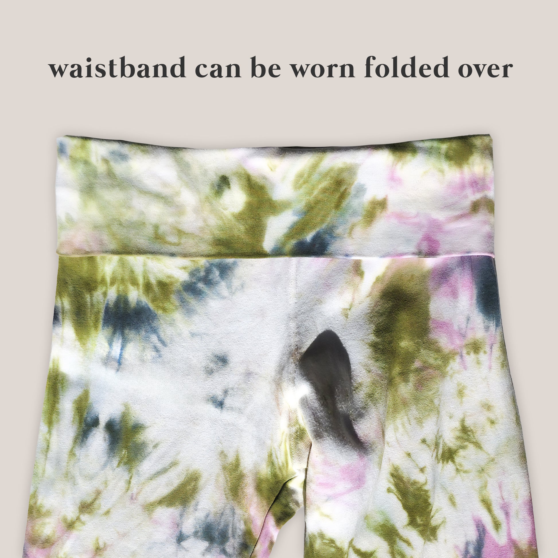 Tie-dye patterned fabric with text indicating waistband can be folded over