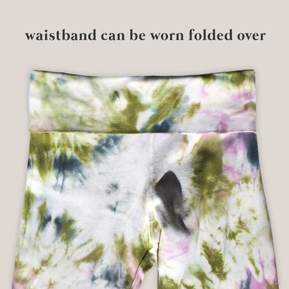 Tie-dye patterned fabric with text indicating waistband can be folded over