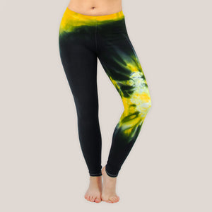 Woman wearing a pair of Akasha Sun yellow chakra tie dye leggings in size small.