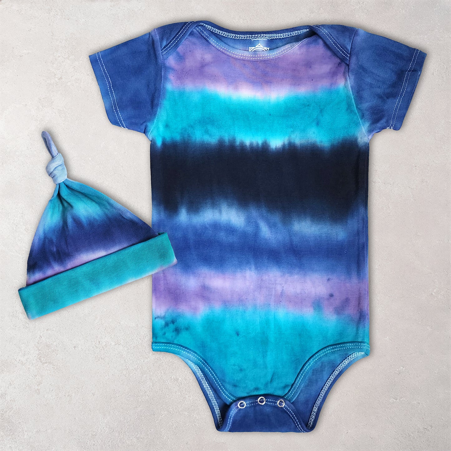 Colorado Dusk Organic Tie Dye Baby Bodysuit + Hat
