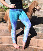 Teal and purple tie dye leggings made of sustainable cotton.