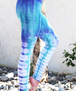 Teal and purple tie dye leggings made of sustainable cotton.