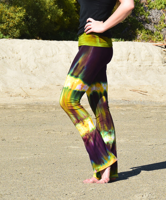 Green + purple cotton spandex tie dye yoga pants with a fold over waistband.