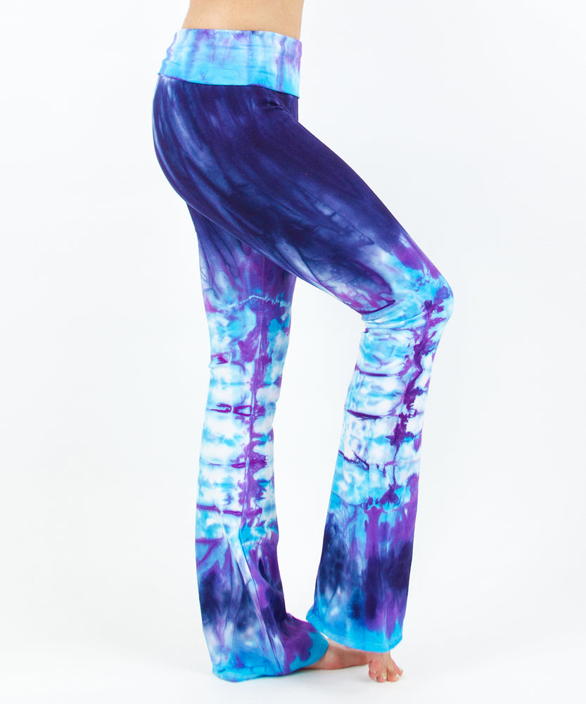
                
                    Load image into Gallery viewer, Woman wearing a pair of purple and blue tie dye sustainable yoga pants by Akasha Sun.
                
            