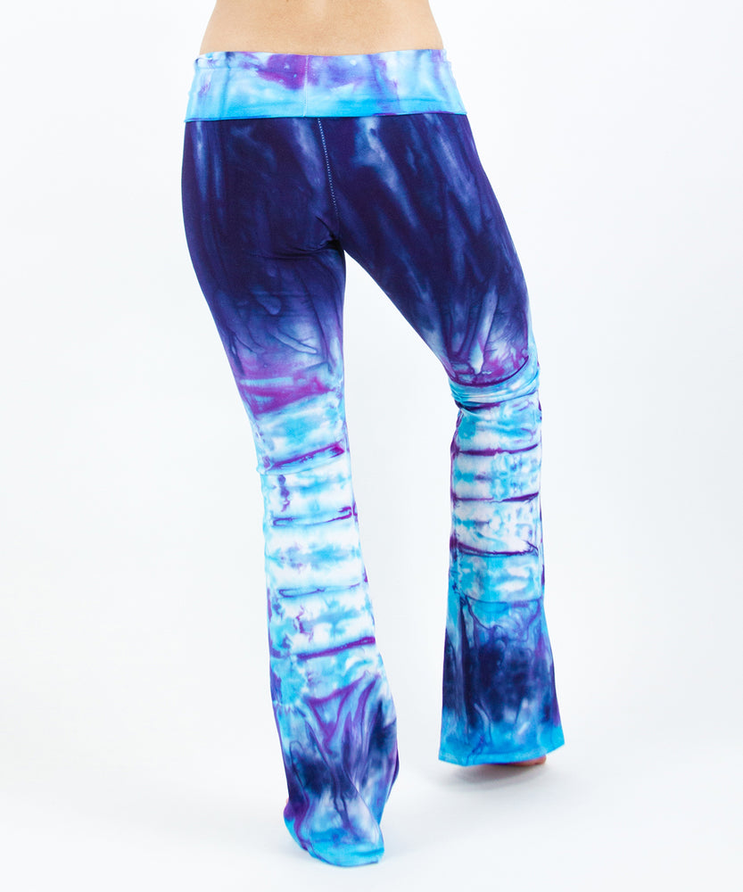 
                
                    Load image into Gallery viewer, Woman wearing a pair of purple and blue tie dye sustainable yoga pants by Akasha Sun.
                
            