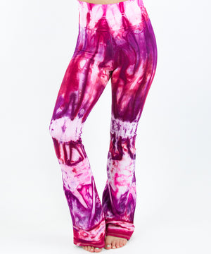 
                
                    Load image into Gallery viewer, Pink, red, and purple tie dye yoga pants with a wide waistband by Akasha Sun.
                
            