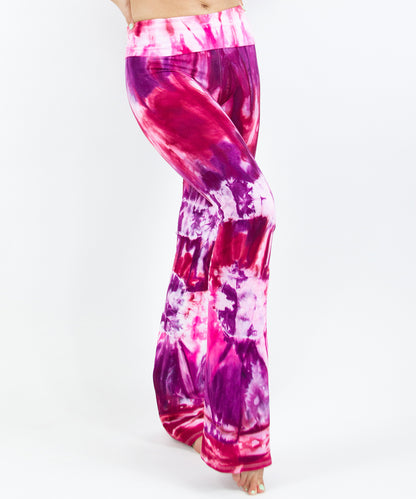 Pink, red, and purple tie dye yoga pants with a wide waistband by Akasha Sun.