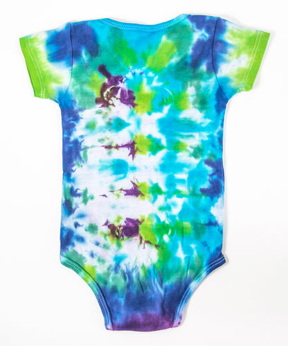 Teal, blue, green, and purple tie dye baby onesie and baby hat set by Akasha Sun.