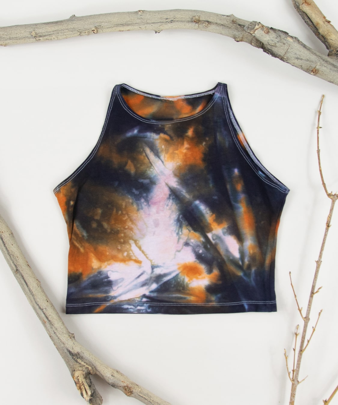 Black + orange tie dye yoga crop top made of cotton spandex material.