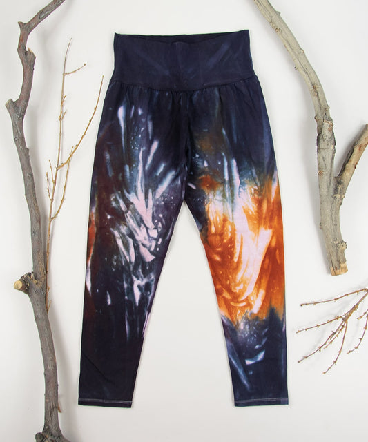 Orange and black tie dye fold over leggings by Akasha Sun.